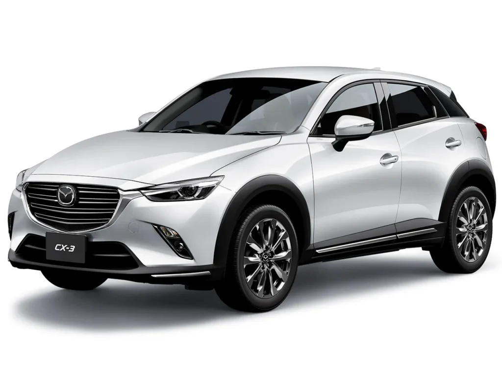 CX-3_2015年モデル | 車買取のソコカラ White Mazda CX-3 compact crossover SUV facing left, showing front grille and side profile.